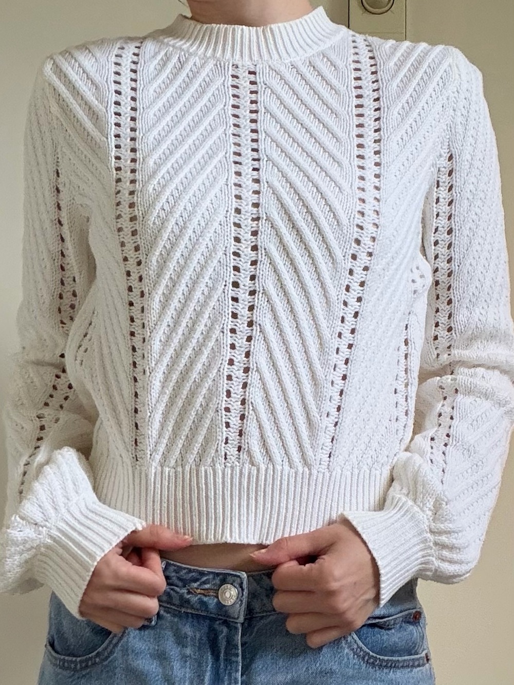 White mockneck knit sweater